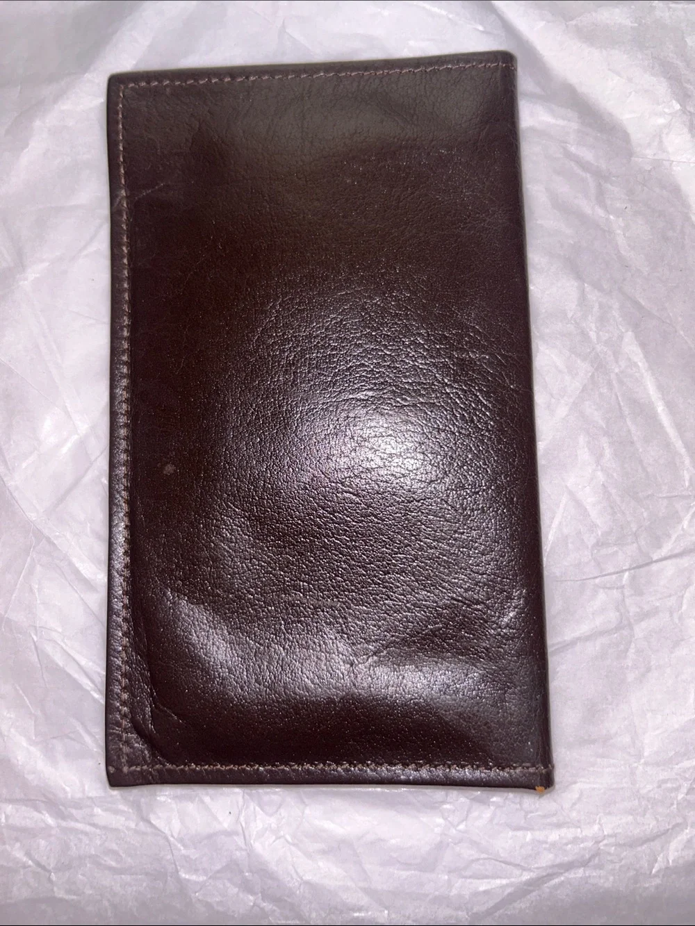 Yves Saint Laurent (YSL) vintage brown leather bifold wallet featuring an emboss